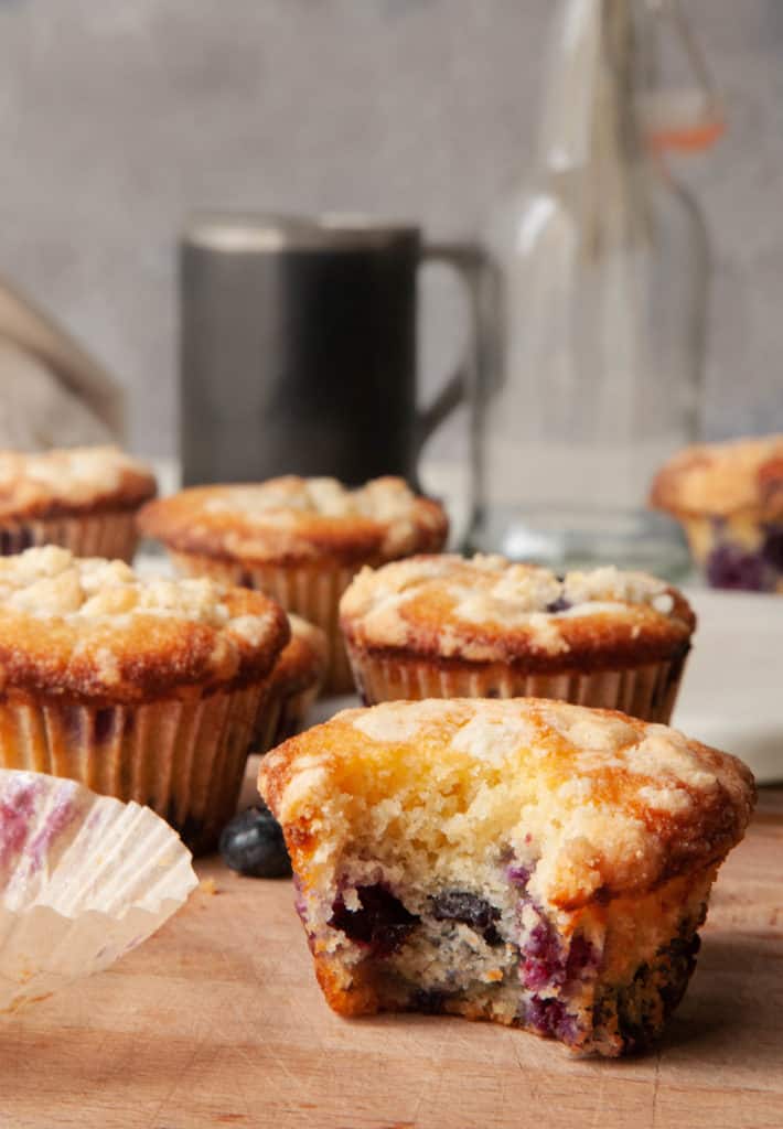 blueberry muffins with a bite taken out of it