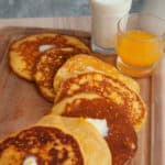 a spread stack of cornmeal pancakes