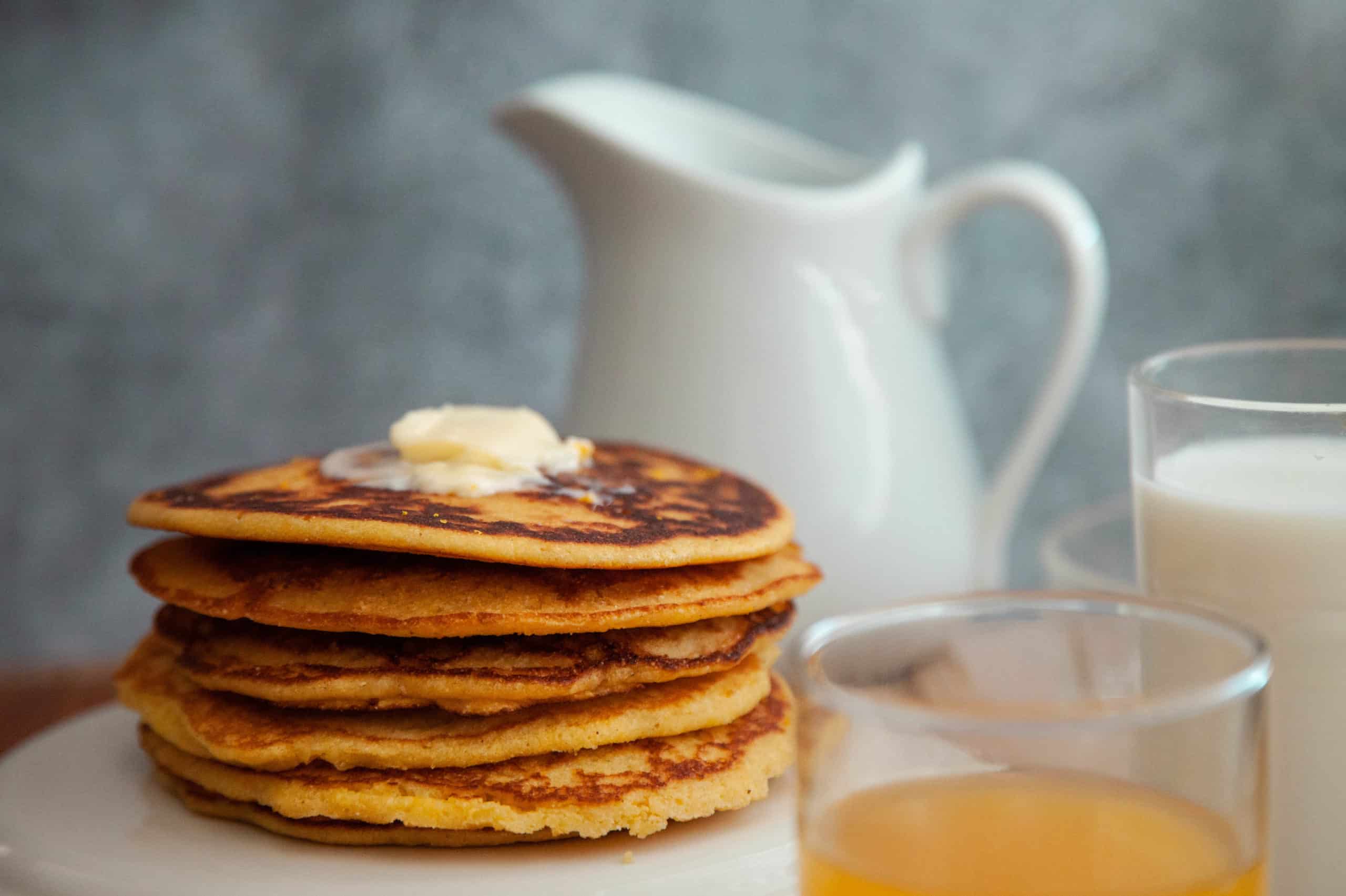 cornmeal pancakes topped with butter